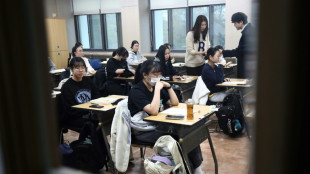 South Koreans sit key exam as flights halted to limit distraction