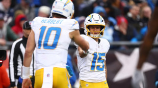 Impressive Herbert leads Chargers into playoffs, Broncos denied