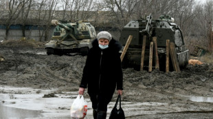 Swamped by state media, Russians near Ukraine toe the line